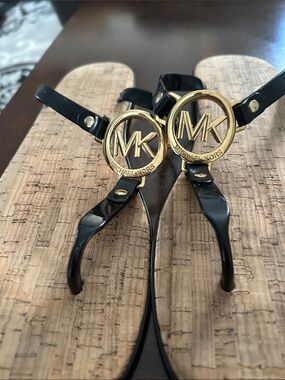 Michael Kors Black Patent Thong Sandals with Gold MK Medallions